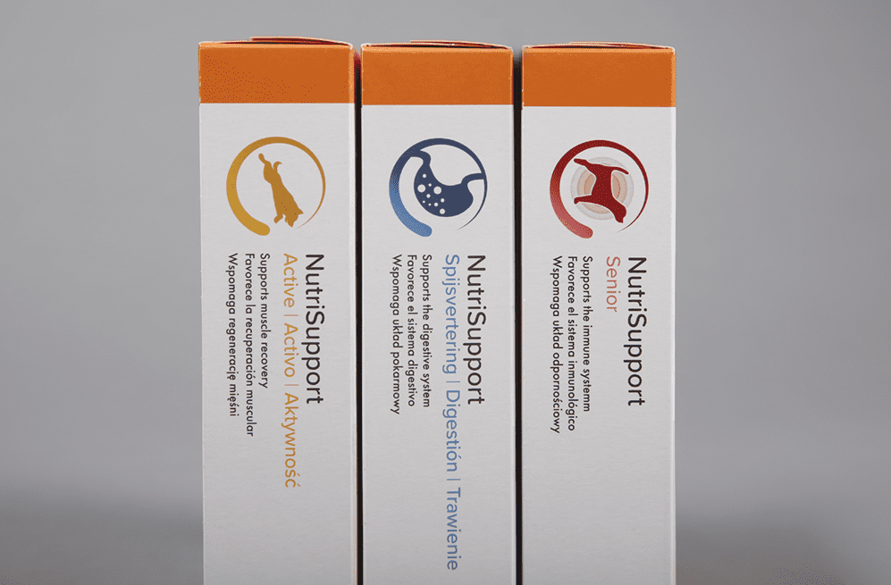 Drie NutriSupport productverpakkingen: Active, Digestion en Senior, met oranje deksel